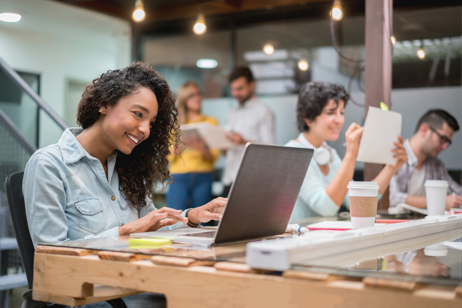 Happy woman working online at a co-working